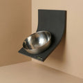 KERQUS AeroBowl wall mounted cat feeder in stainless steel installed on a wall