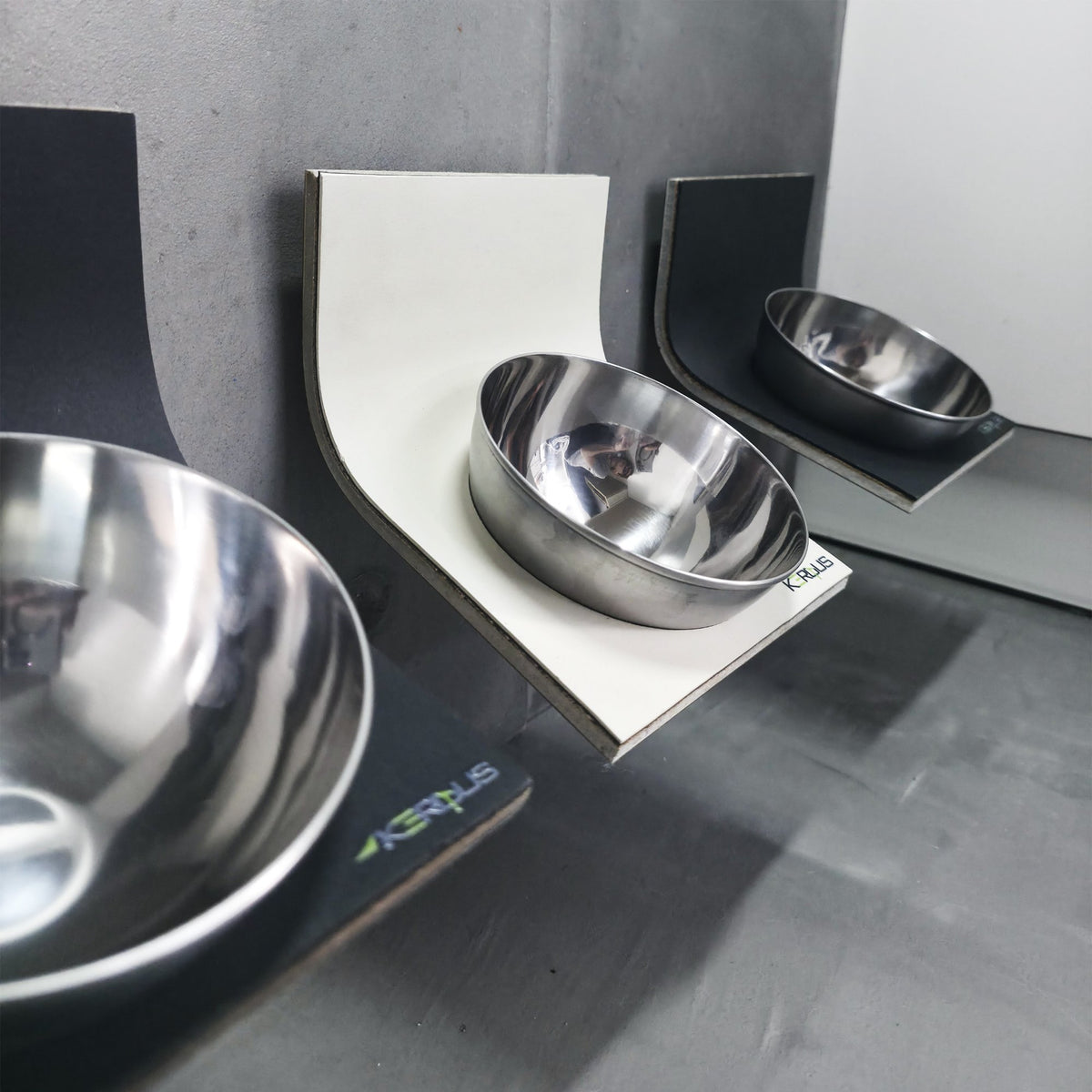 Close-up of the stainless steel bowl on the KERQUS AeroBowl wall mounted cat feeder